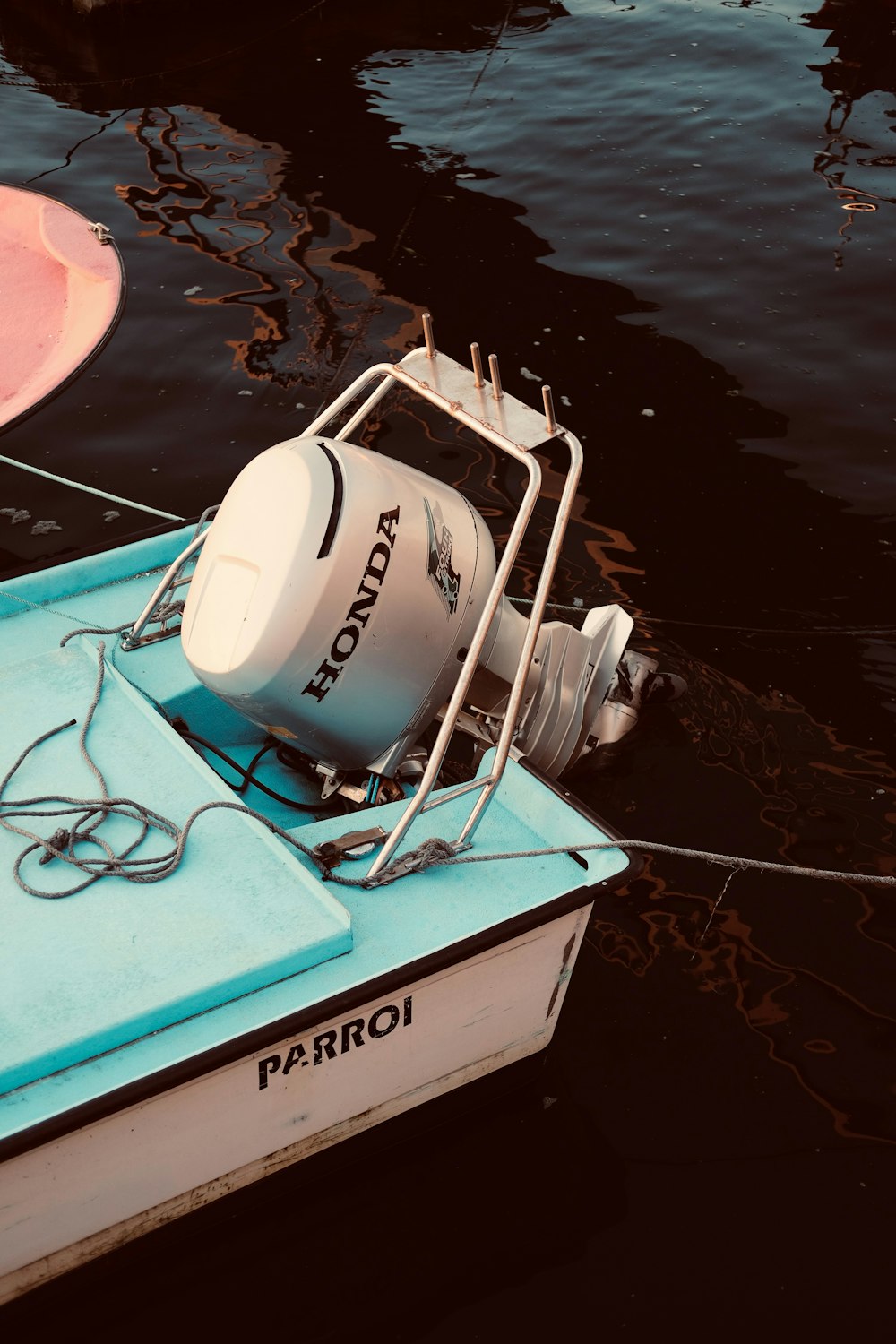 Saltwater boat operating in Mediterranean waters with visible salt spray