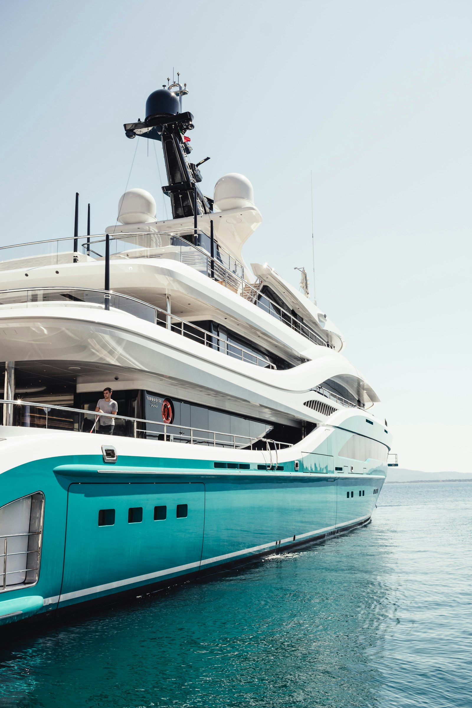 Yacht owner reviewing marine maintenance invoice with mechanic
